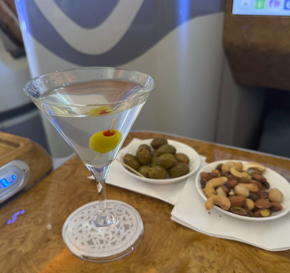 Perfect Martini with nuts and olives